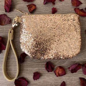 Sequin wristlet with removable strap